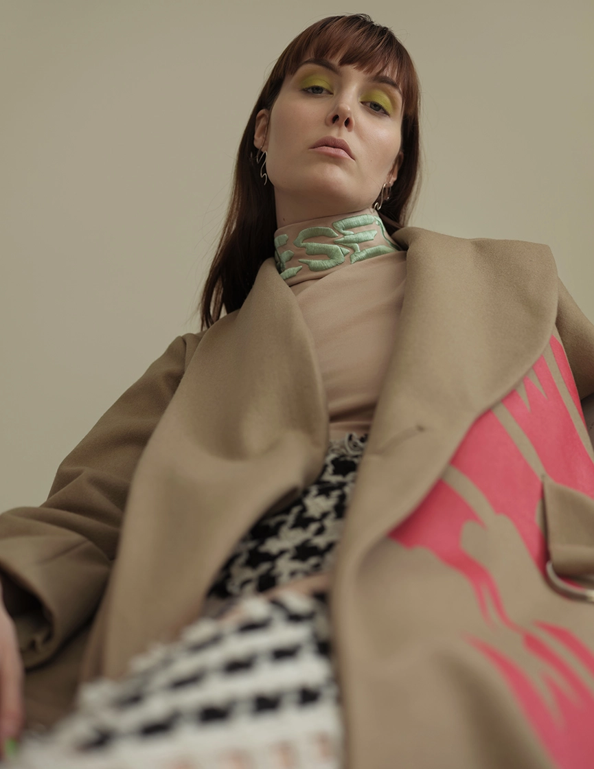 female model looking down into camera